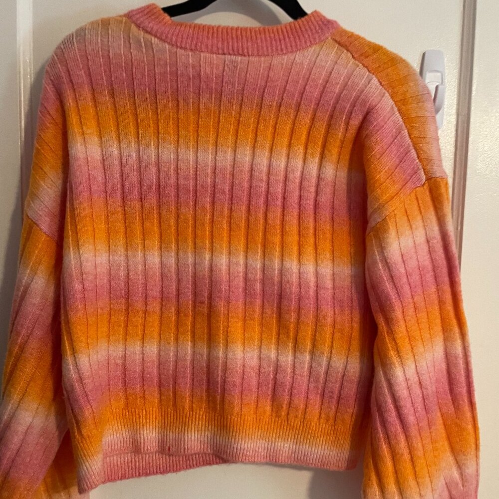 Divided pink, orange and white sweater